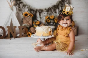 Sunflower themed golden yellow cake smash portrait