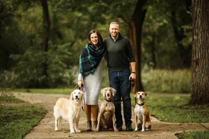 Family photo session with dogs in park
