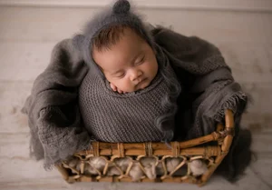 Newborn in basket wrap photo in Dallas