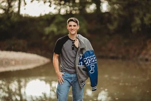 Denton Texas senior boy in letterman jacket portrait