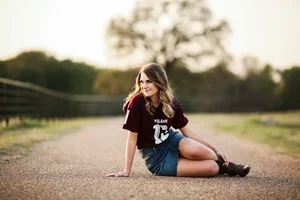 Senior portrait on country road with Texas A&M shirt