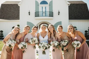 Bride and bridesmaids laughing at Dallas wedding
