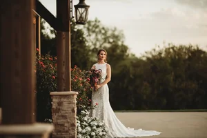 Bride in lace dress with roses in suburban DFW