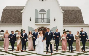 Wedding party at white barn in Denton County